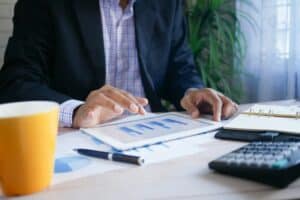 Man looking at finances on ipad